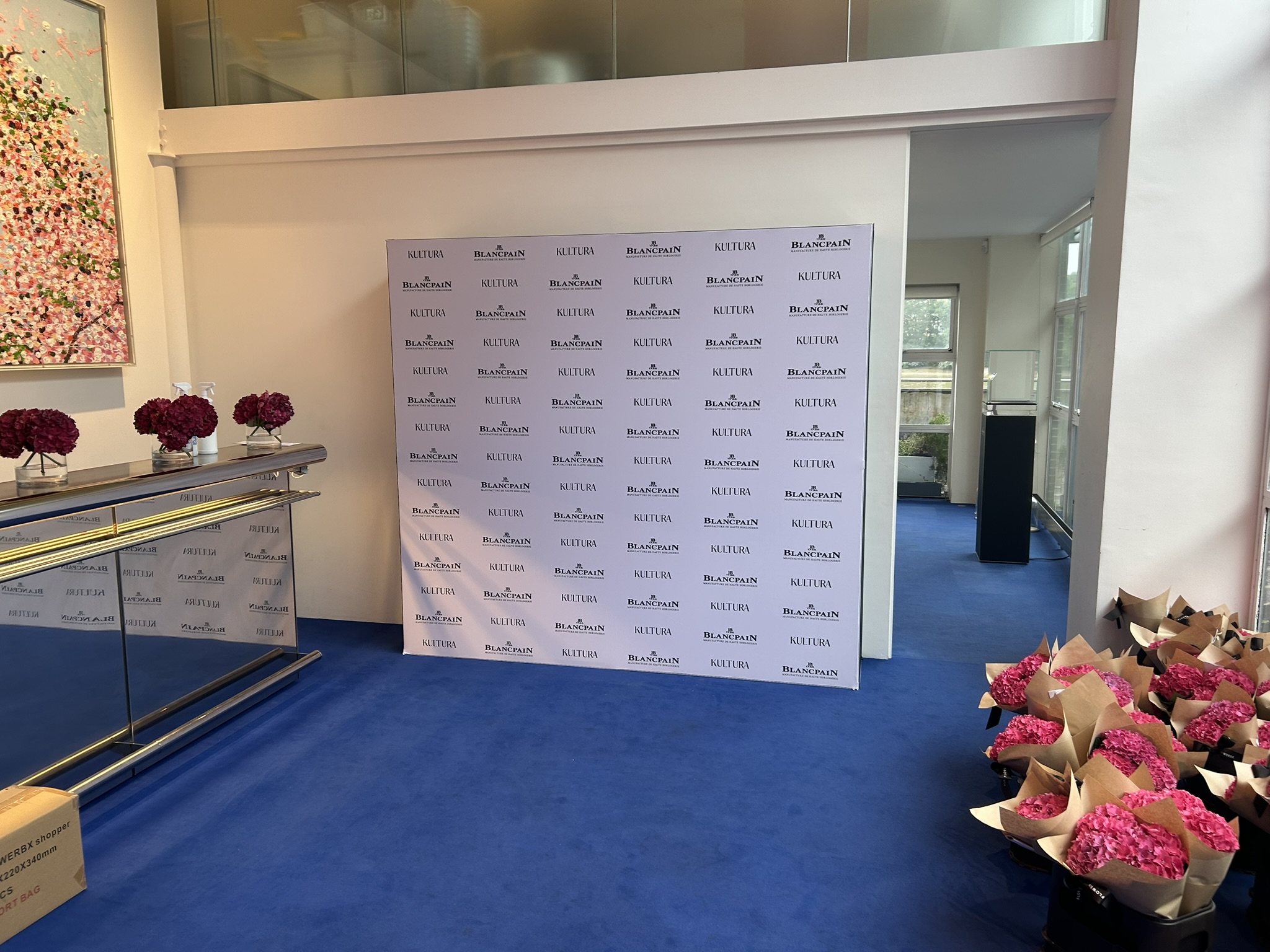 2.2m white step and repeat wall with logos. River caf� hammersmith
