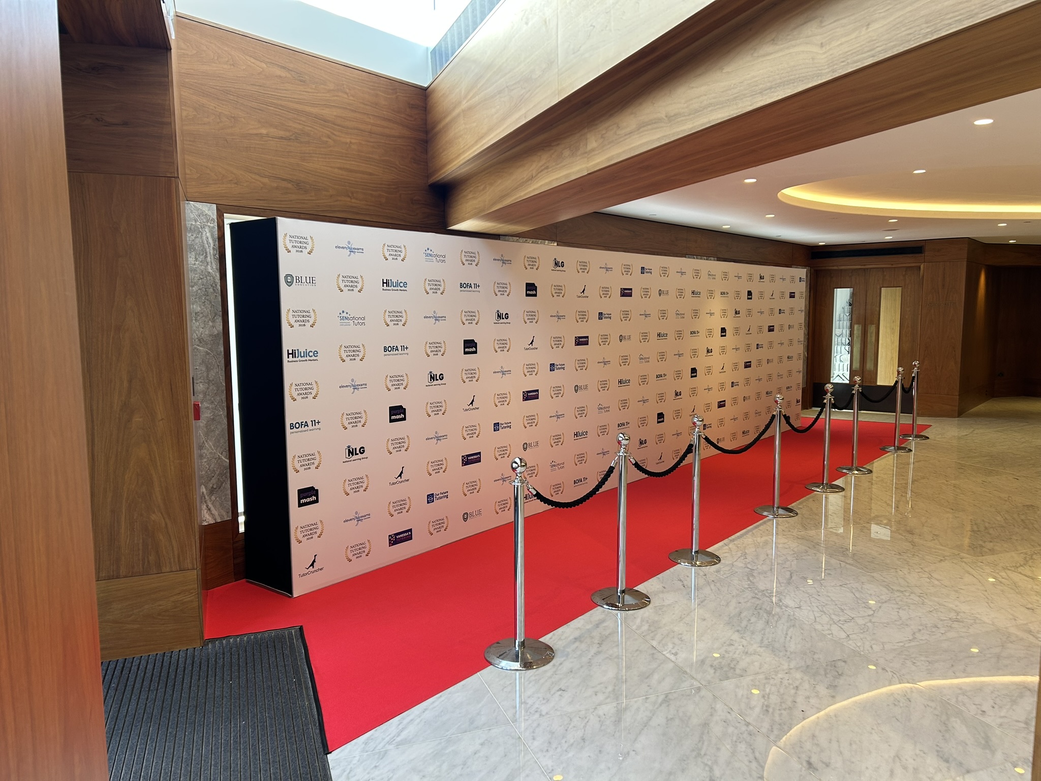 8.4m Photo wall with red carpet for an awards show at the Royal Lancaster Hotel London