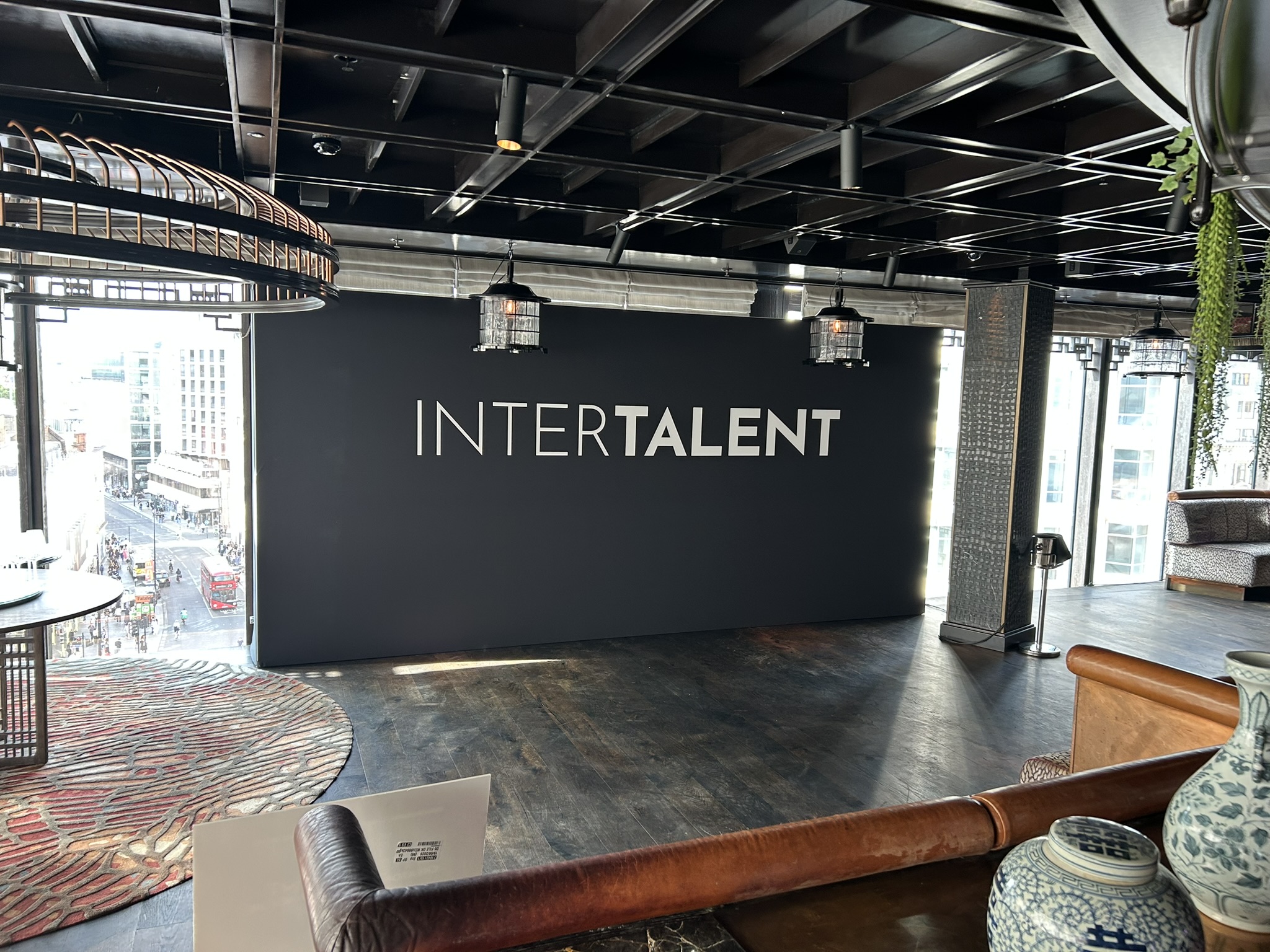 3 meter wide backdrop with client logo on large. black backdrop with white text