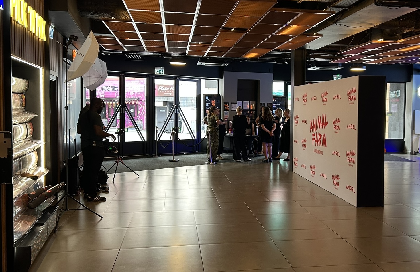 Step and repeat photo back drop with photographers