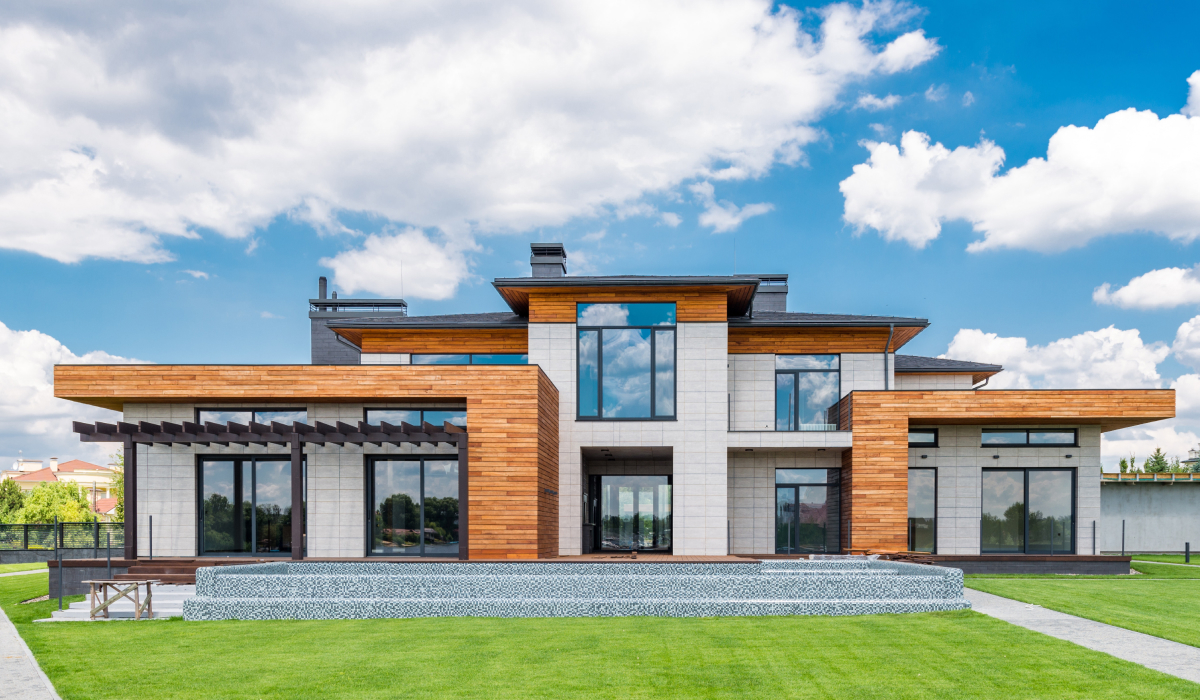 Modern home with wood accent siding and light stone panel exterior