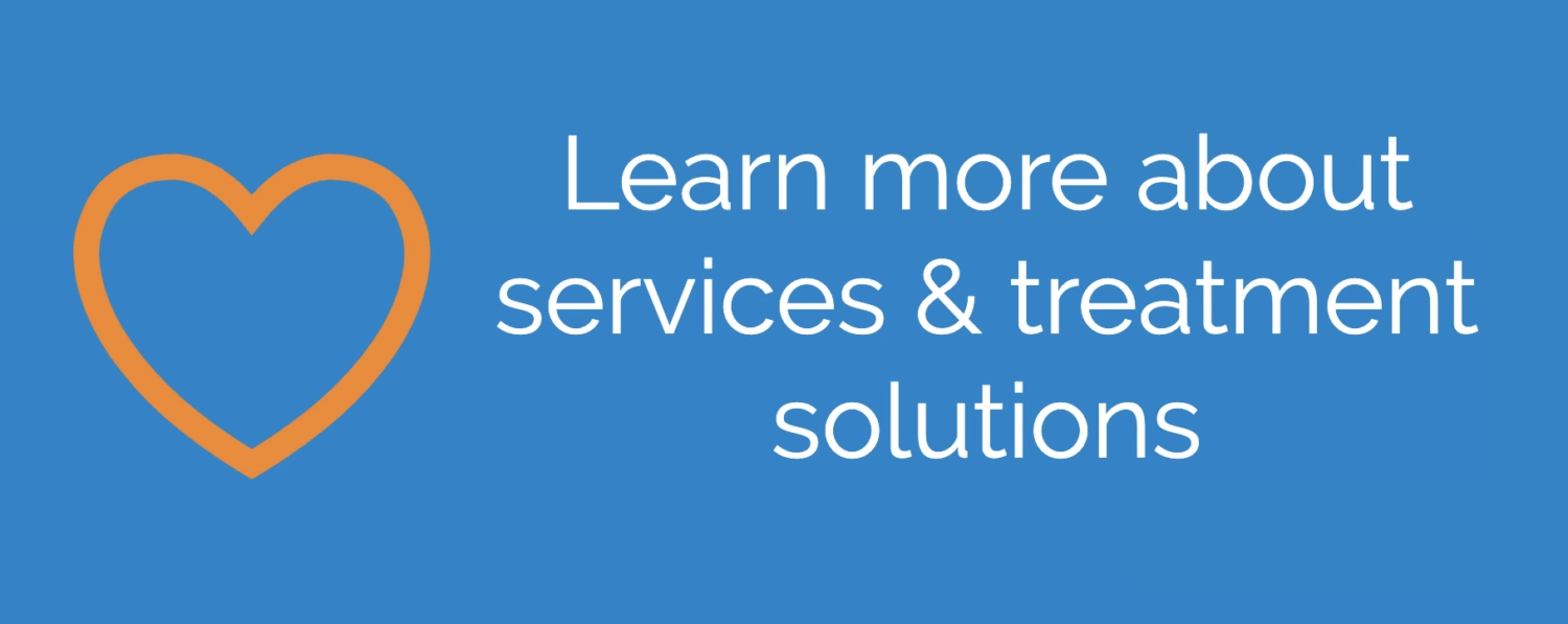 Orange heart icon next to text reading 'Learn more about services & treatment solutions' on a blue background.