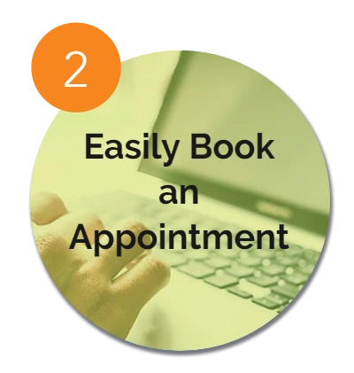 Step 2: Easily book an appointment with a hand typing on a laptop keyboard.