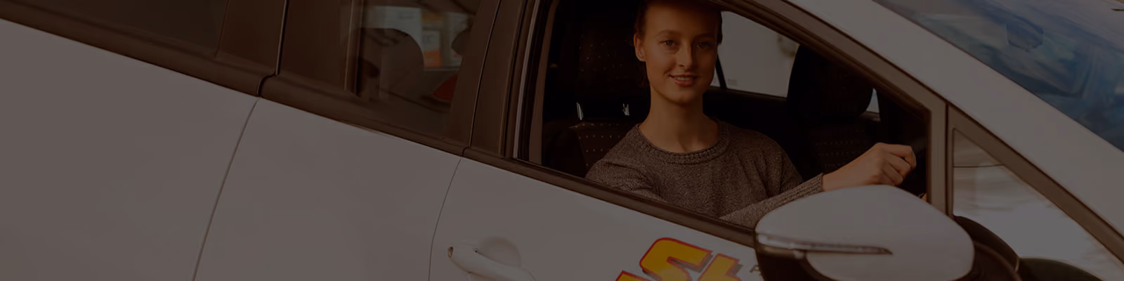 Banner image for accident repair services, showing a detailed view of a car undergoing repairs.