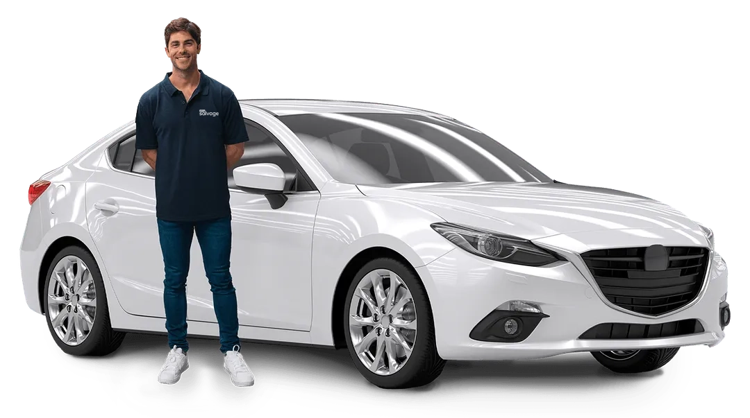 Smiling person in blue polo standing next to sleek white Mazda sedan