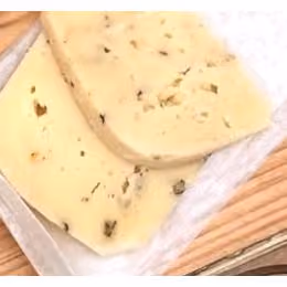 An alpine style cheese with a semi-soft texture and nutty flavors. The milk is infused with a black peppercorn tea before being cultured. The peppercorns are crushed and added back to the curd during the molding. After being pressed and brined, the wheels will head to our cave where they will be regularly turned and brushed for 5 months. Pairs well with any wine.