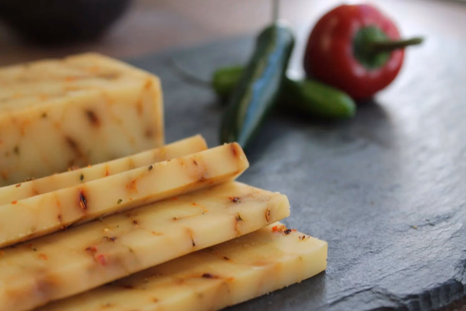Pale ivory cheddar with flecks of peppers