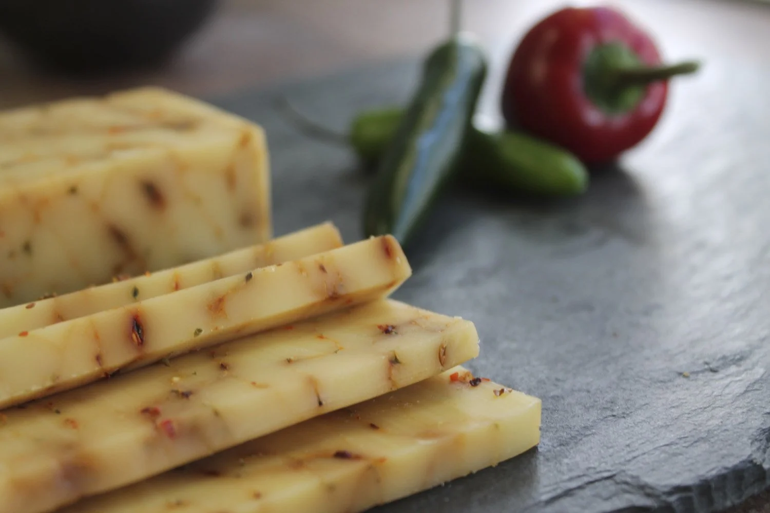 Pale ivory cheddar with flecks of peppers 