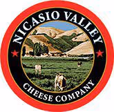 Nicasio Valley Cheese Company Logo showing red ring with inner black ring containing white text and a depiction of the Nicasio Valley in the center.