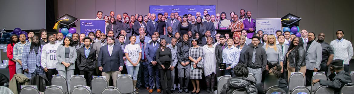 A large group of people pose for a picture together