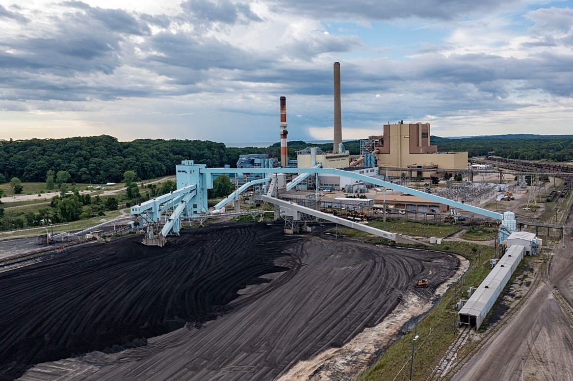 J.H. Campbell coal-fired power plant with pile of coal in front