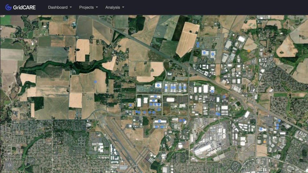 A satellite view of Hillsboro, Oregon, with sites of data centers identified with blue dots. (Gridcare)