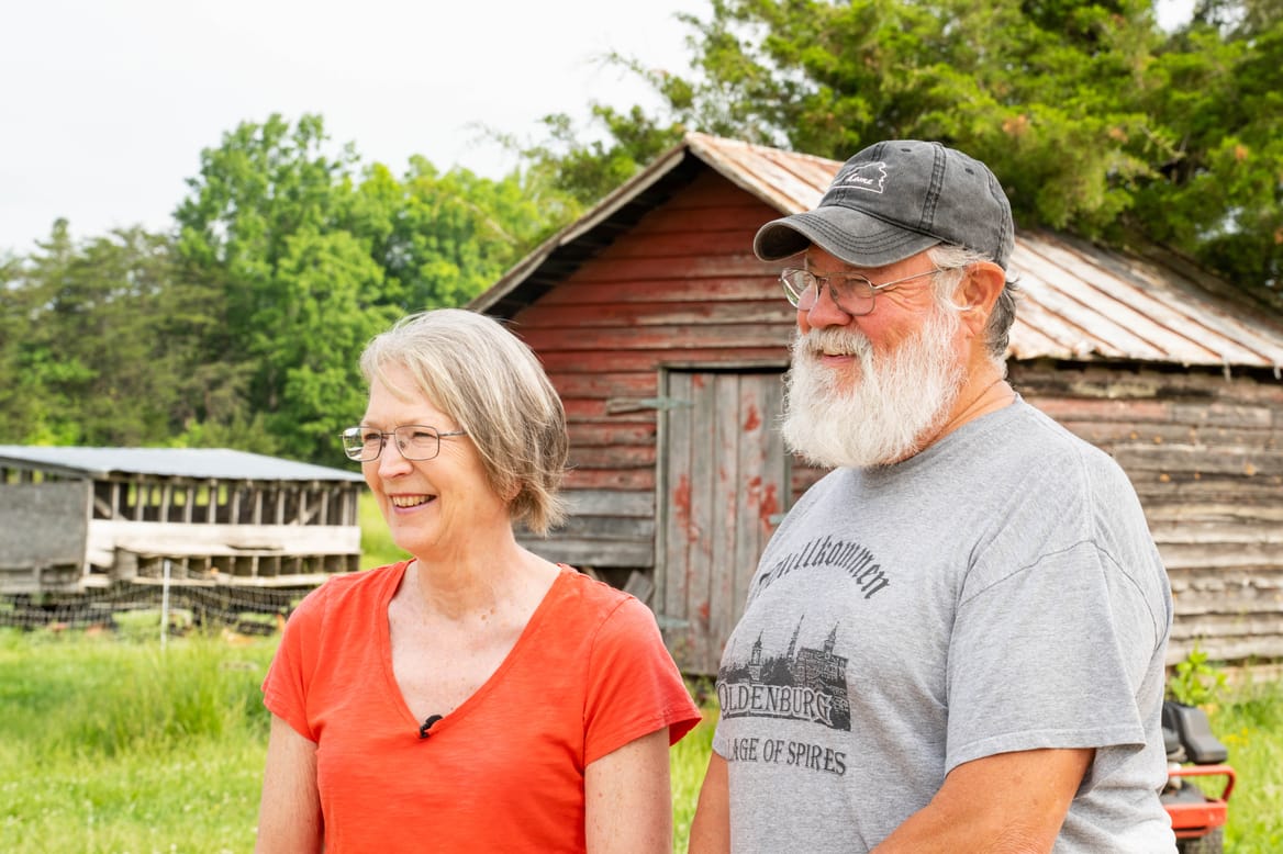 Man and woman near barn