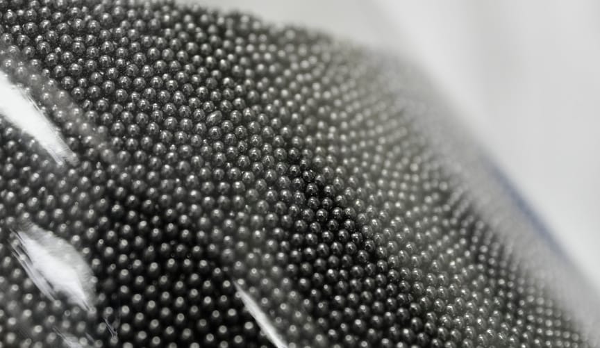 Closeup of TRISO fuel, in the form of small black balls
