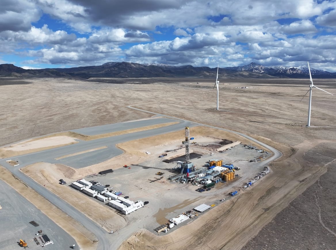 Overview of a geothermal well in a desert-esque landscape