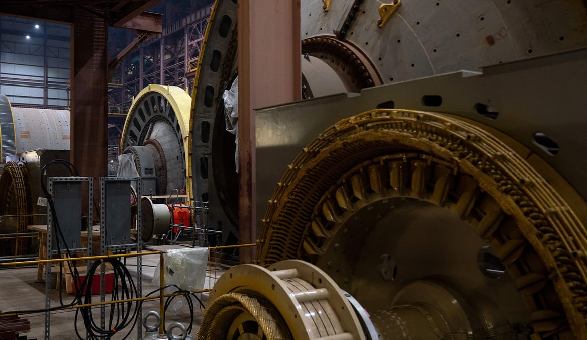 Close-up of cylinders and their many gears in metal building