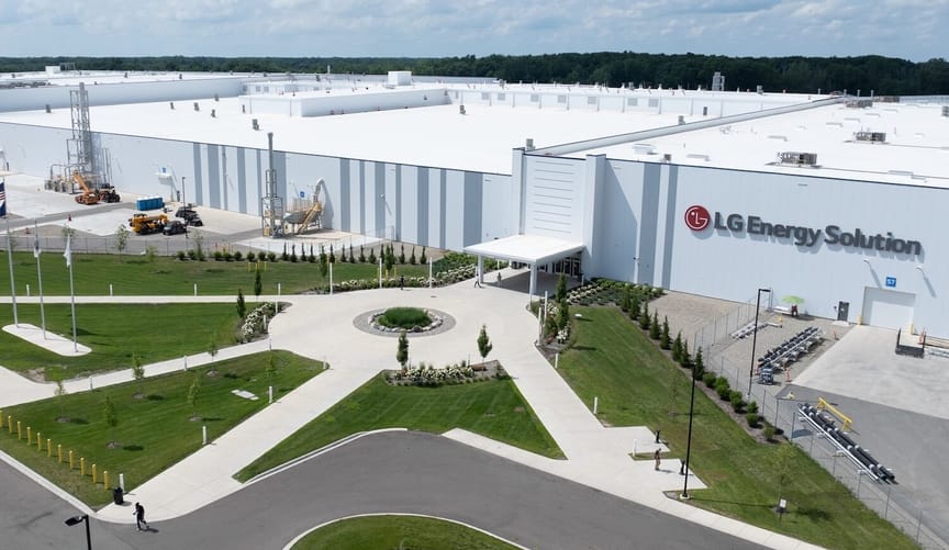 Large white production plant with red logo and sign saying LG Energy Solution
