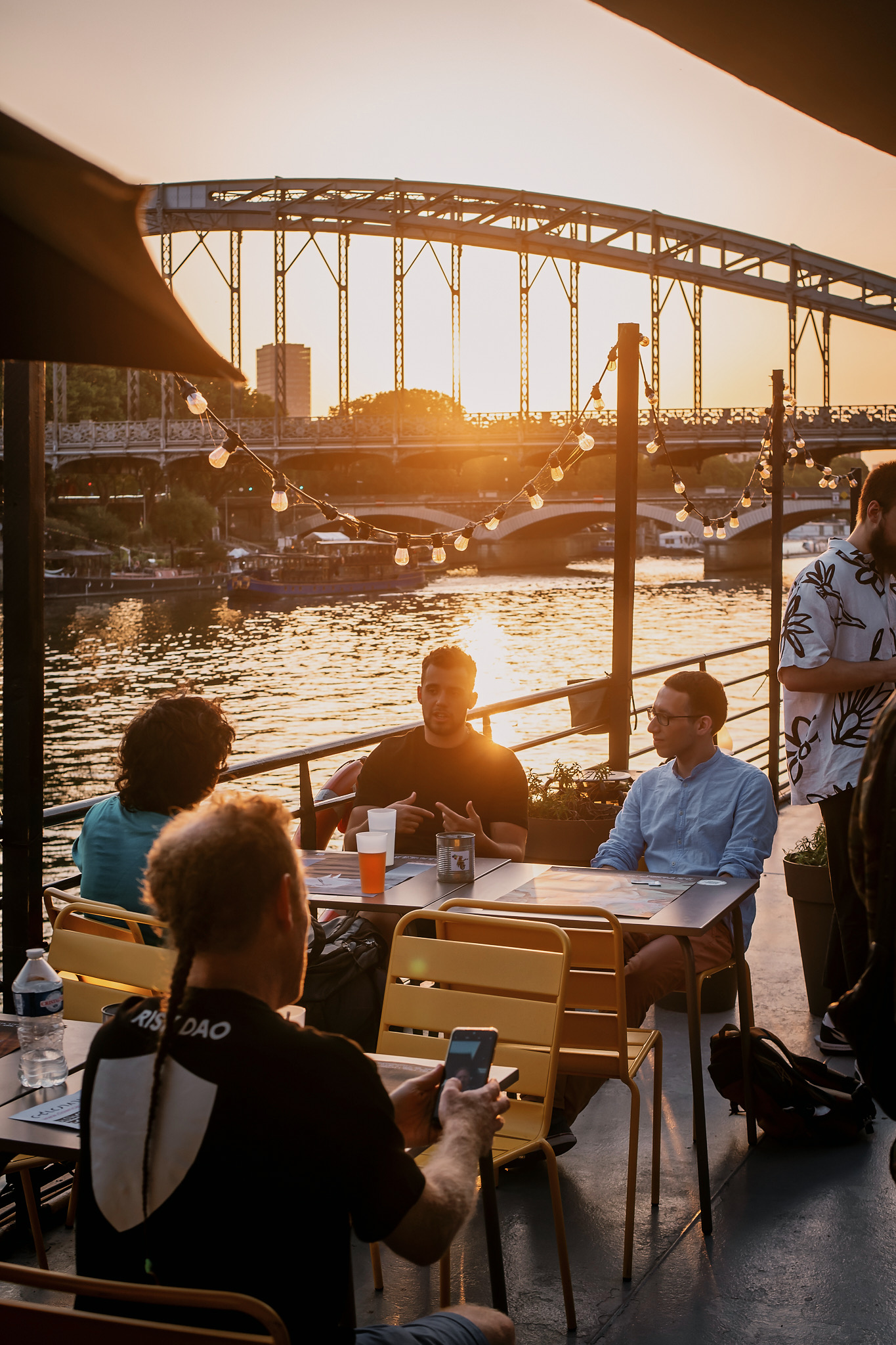 a beautiful image of sunset and water with a bridge in the background