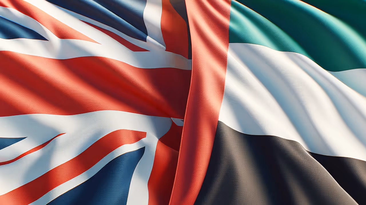A flag of the United Kingdom is flown next to a flag of the United Arab Emirates.