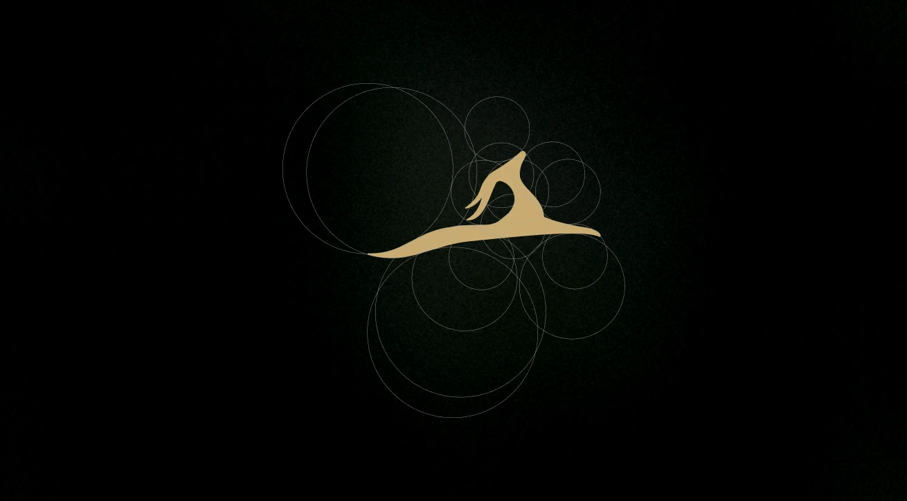 This image captures the Golden Gazelle logo in its purest form—an elegant gazelle silhouette crafted from precise geometric proportions. Rendered in a refined gold tone against a deep black background, the logo reflects balance, motion, and grace. The circular grid behind the mark highlights its mathematical symmetry, showcasing thoughtful design rooted in timeless aesthetics. The symbol embodies Golden Gazelle’s philosophy of elegance in structure and strength in subtlety, perfectly aligning with the brand’s identity of curated luxury and enduring craftsmanship.
