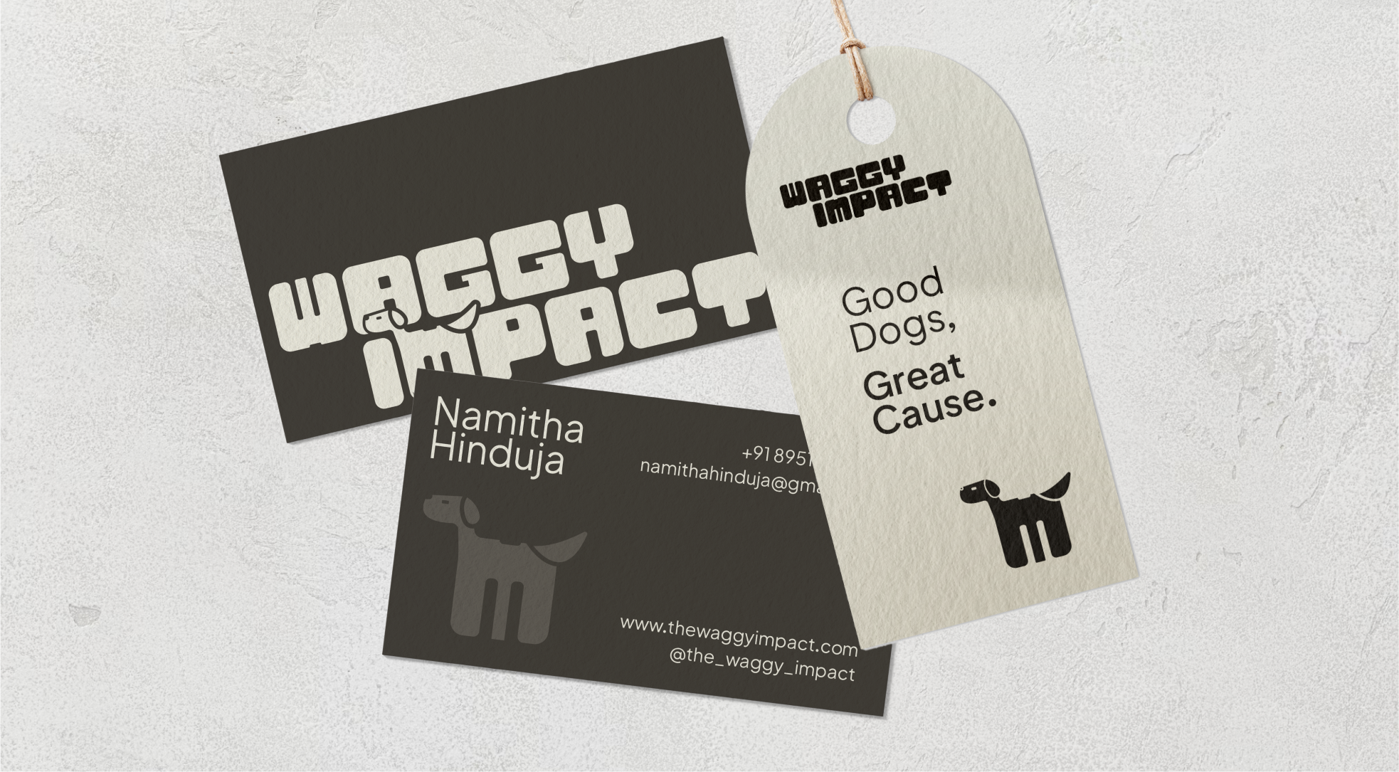 Brand collateral design for Waggy Impact by Dot and Grid – business cards and hang tag showcasing custom typography, dog icon, and tagline ‘Good Dogs, Great Cause’ in a clean minimalist layout