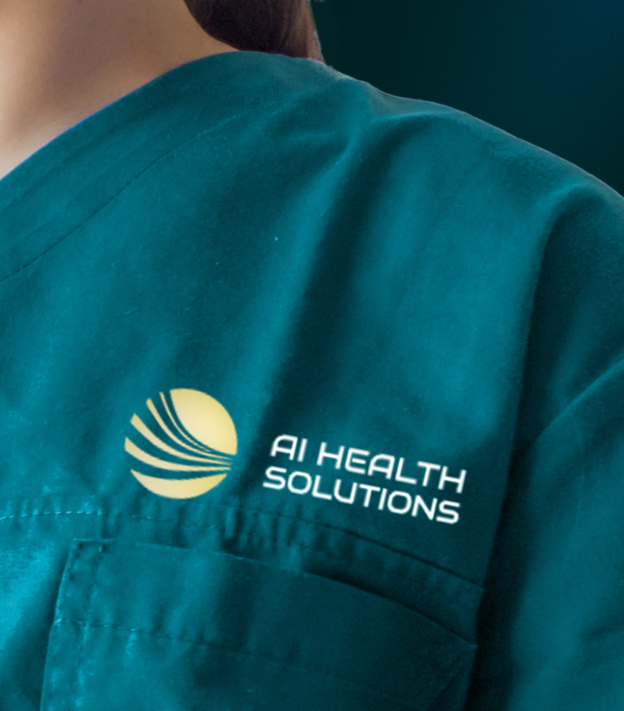 Close-up of a medical professional wearing teal scrubs with a logo that reads AI Health Solutions, featuring a yellow circular emblem beside the text.