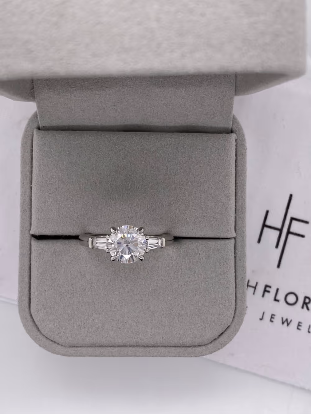 Round Engagement Ring with Tapered Baguettes