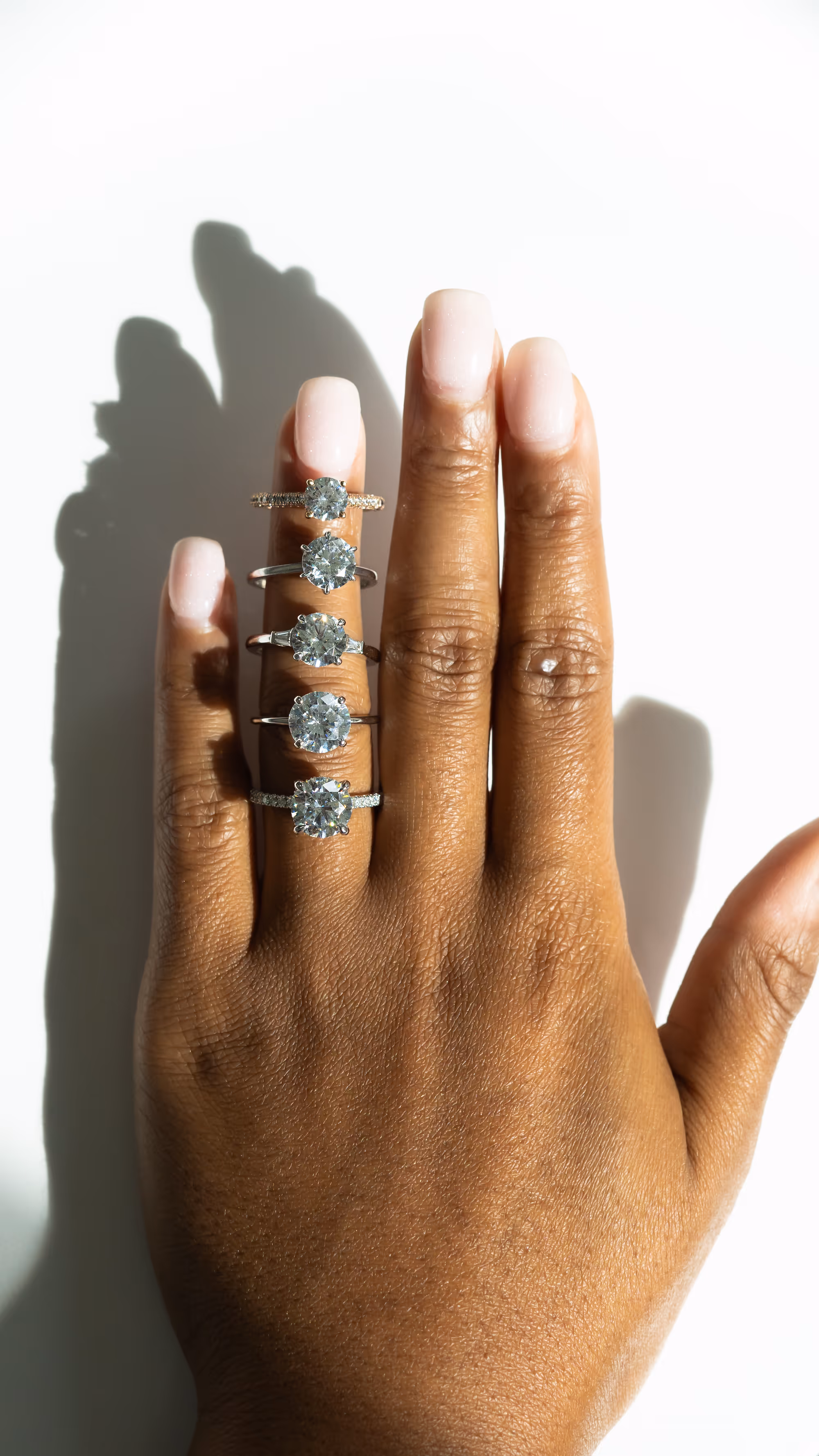 A sampling of round engagement rings by Hannah Florman