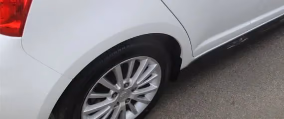 Image of a Suzuki Swift after repair, showcasing a clean and restored appearance.