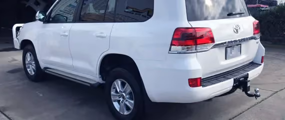 Repaired front view of a white Toyota.