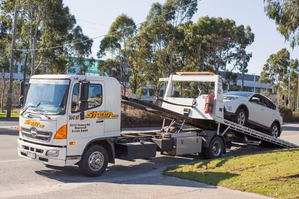 Our insurer-approved Melbourne panel beater at the computer, making a claim.