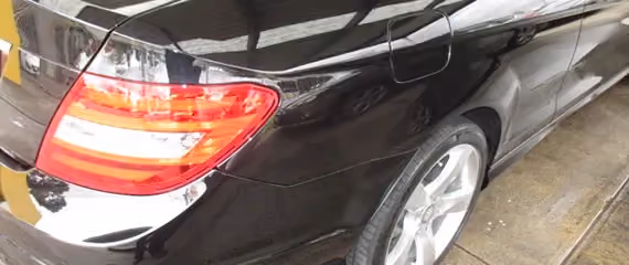 Photo of a Mercedes C180 after repair work, showcasing the restored exterior.