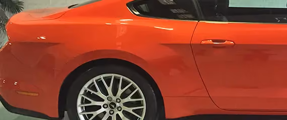 Presents a Ford Mustang after repair, showcasing the car’s muscular build and pristine condition.