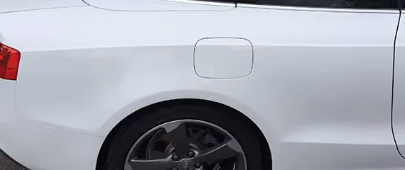 Image of a generic car after professional repair, highlighting a sleek and impeccable finish.
