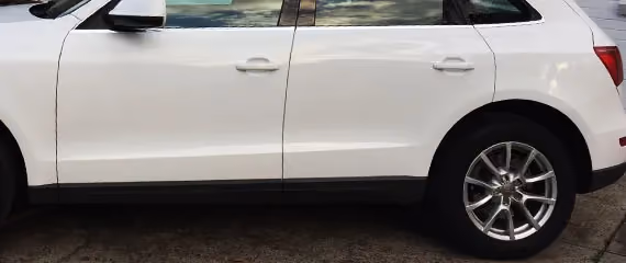 Shows a second generic car after repair, presented in optimal condition.