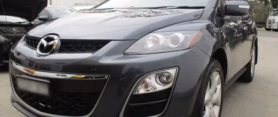 Photograph of a Mazda vehicle post-repair, displaying the car’s renewed exterior.