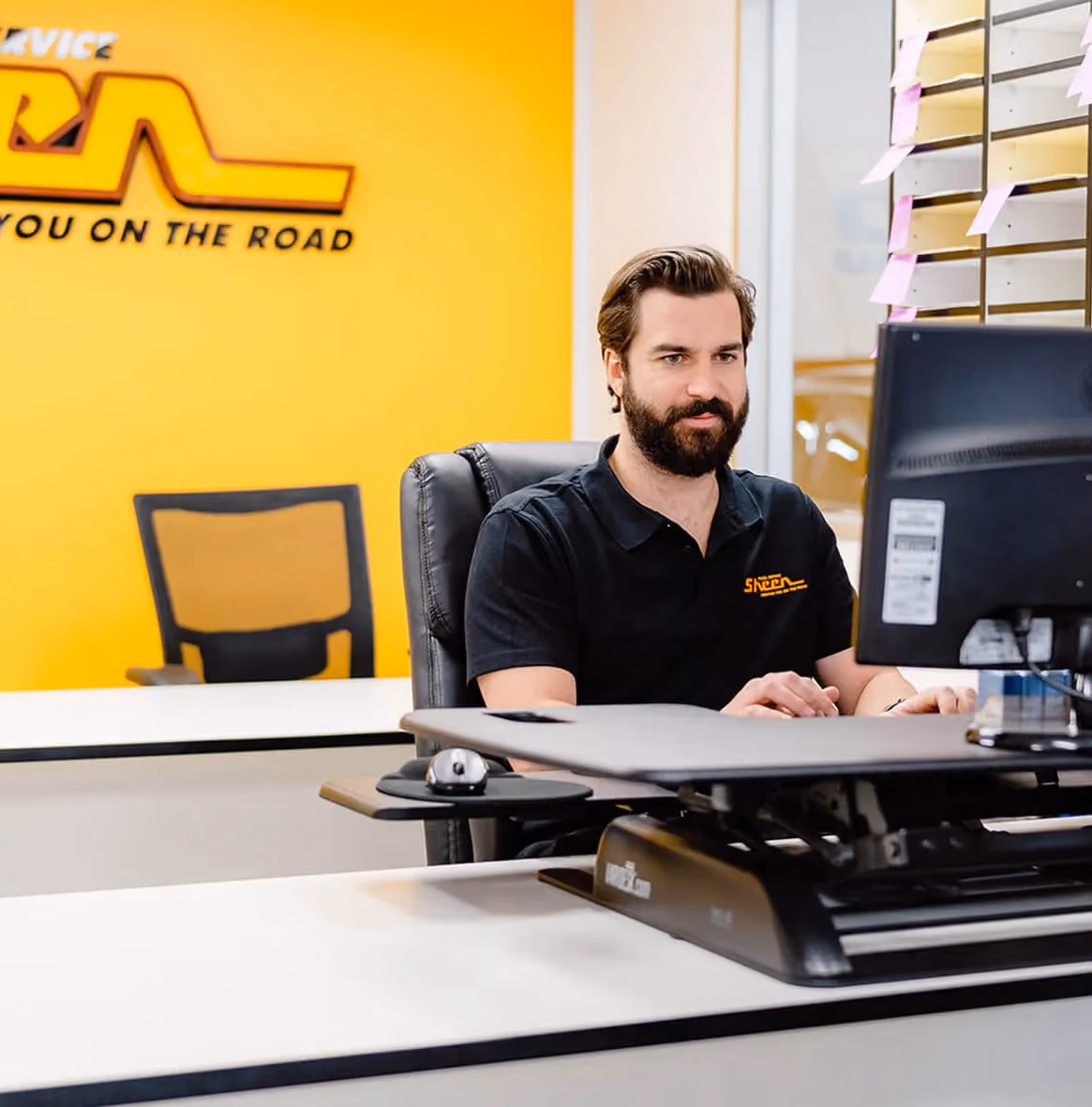 Our insurer-approved Melbourne panel beater at the computer, making a claim.