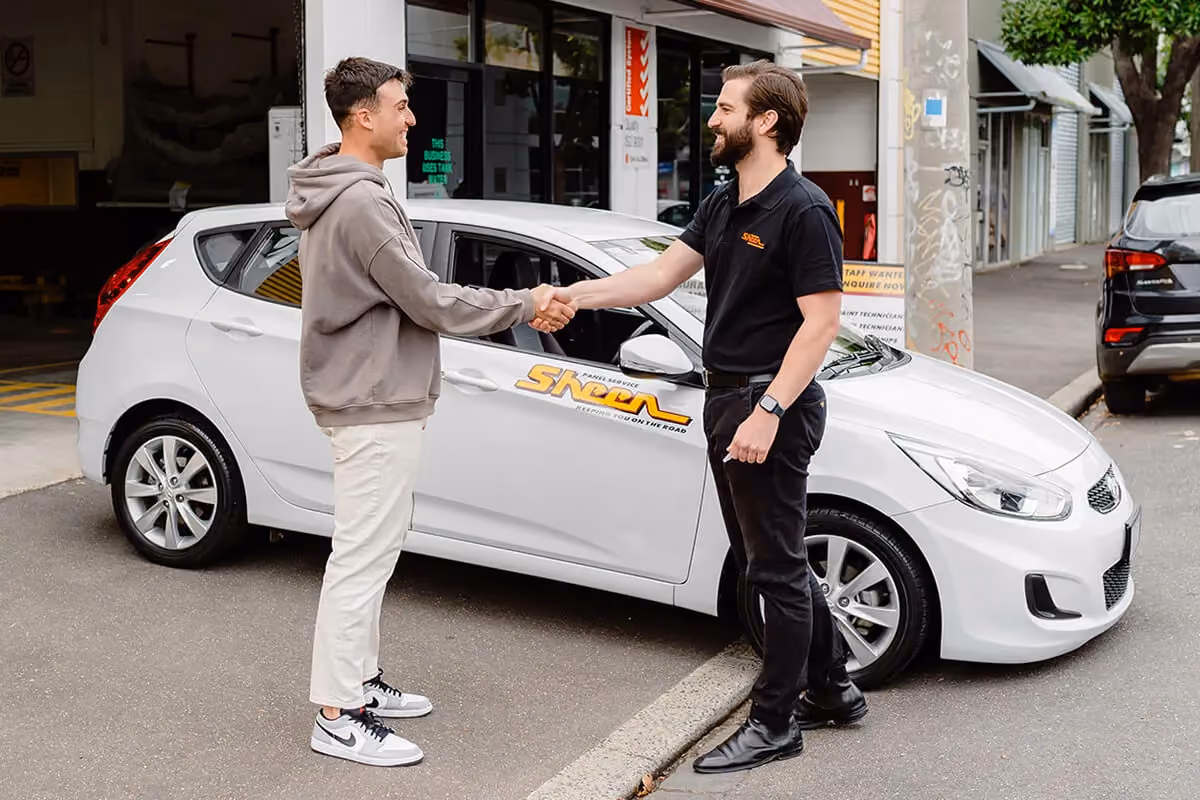 Our insurer-approved Melbourne panel beater at the computer, making a claim.