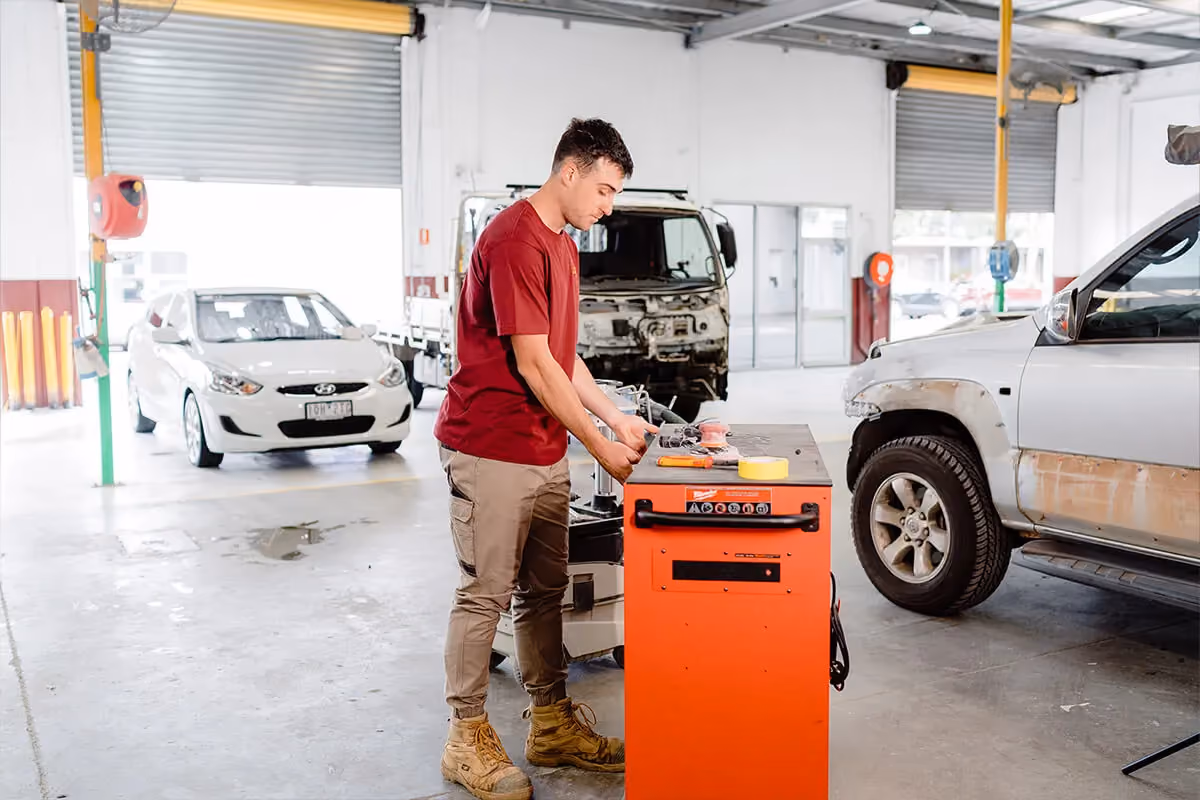 Our insurer-approved Melbourne panel beater at the computer, making a claim.