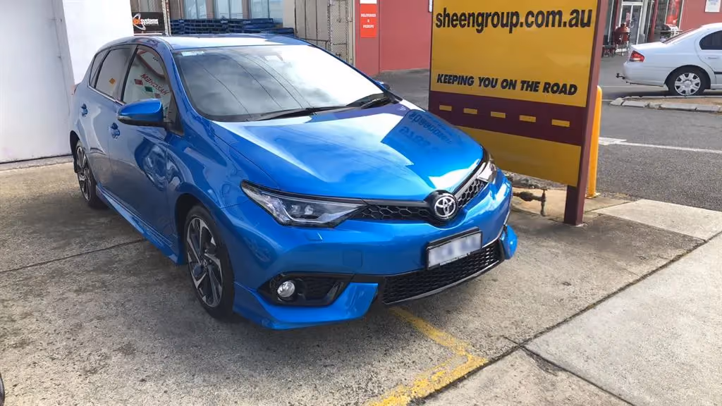 Toyota Corolla displayed after front-end repair, looking new and well-maintained.