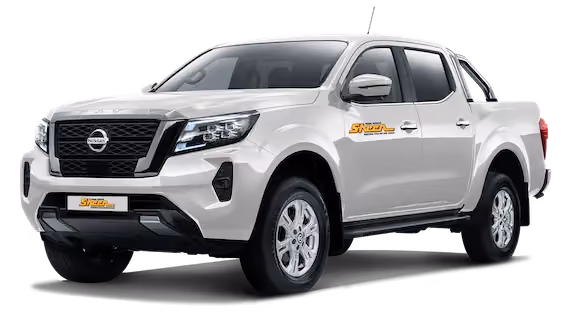 Robust image of a Nissan Navara truck, captured to show off its sturdy build and suitability for rugged terrains.