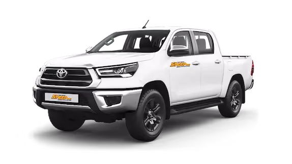 Dynamic image of a Toyota Hilux in an outdoor setting, illustrating its capabilities as a reliable utility vehicle.