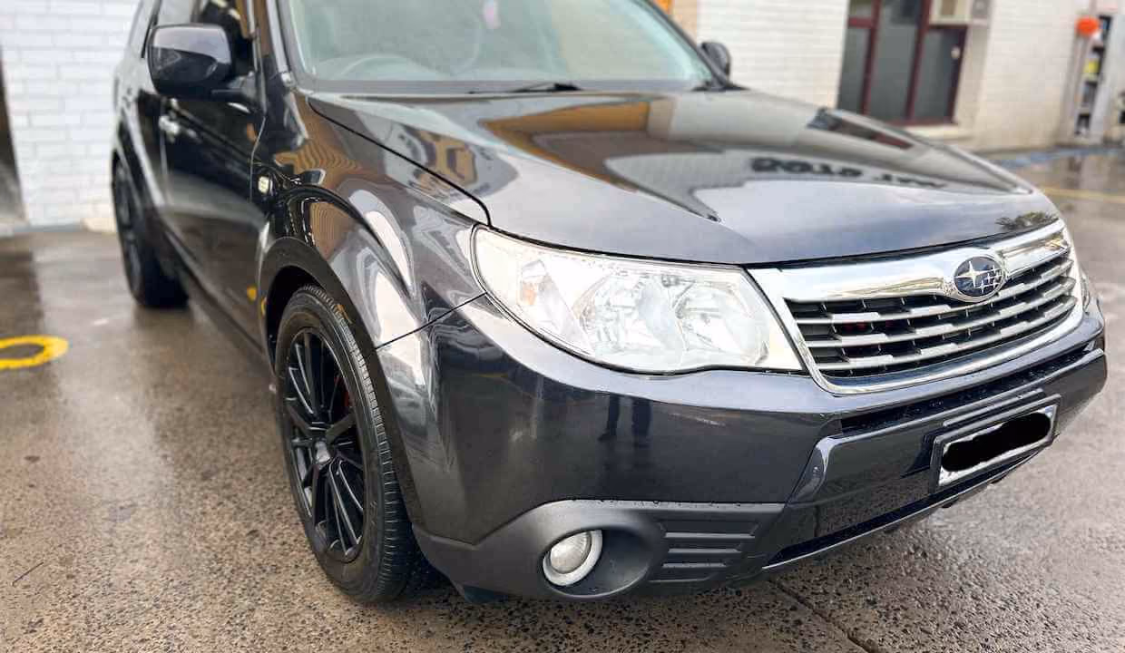 Shows a Subaru Forester after repair in an outdoor setting, focusing on the vehicle's durable design.