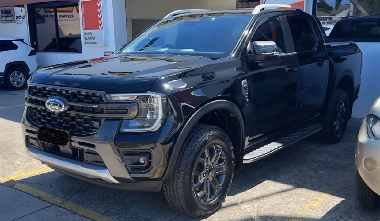 Displays a Ford Ranger after repair, fully restored with a smooth, undamaged front and side panel, perfectly aligned bodywork, and a factory-fresh finish.