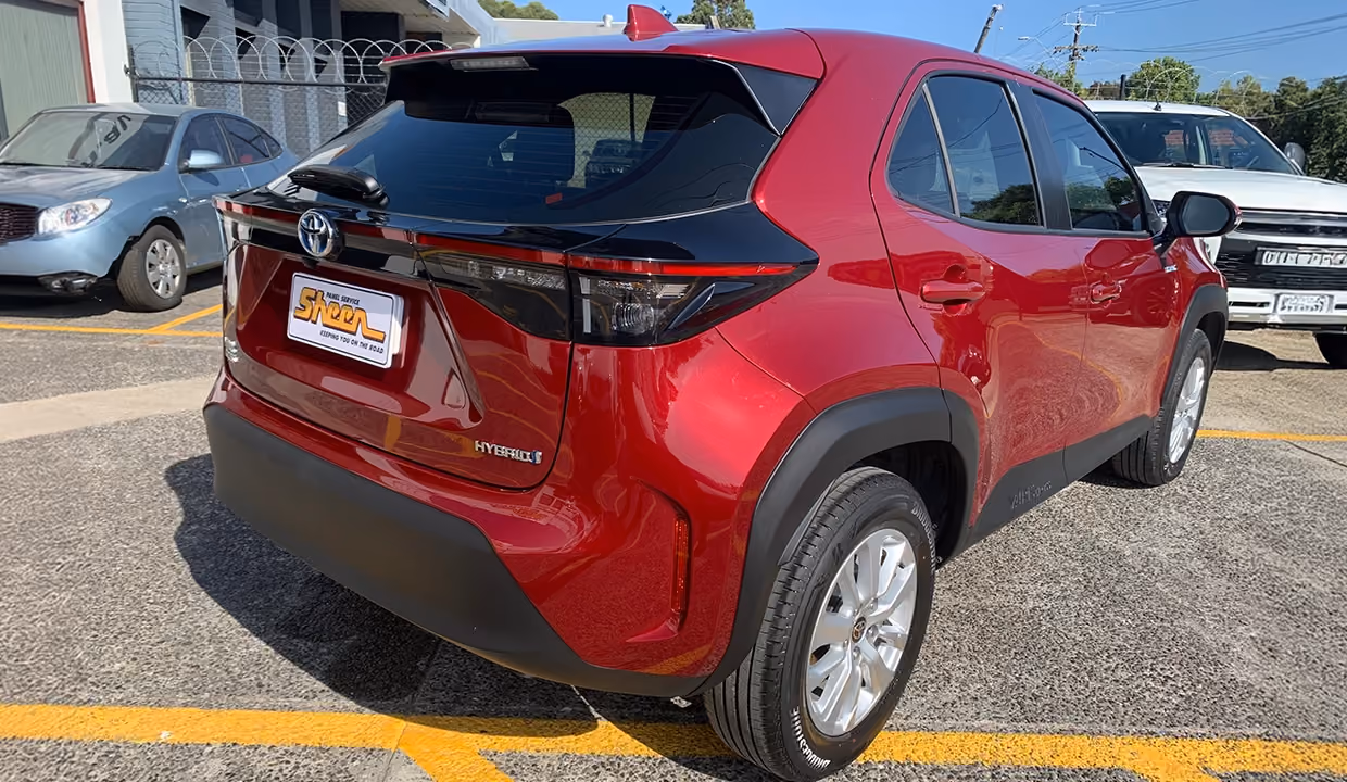 Displays a Toyota Yaris Cross after repair, fully restored to original condition with a smooth rear finish, realigned lighting, and flawless bodywork throughout.