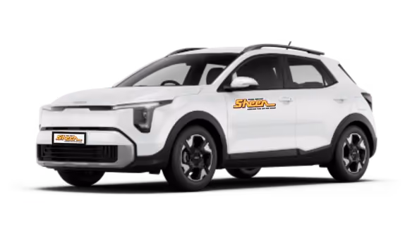 White Kia Stonic compact SUV viewed from the front-left angle with black trim, roof rails, and alloy wheels.
