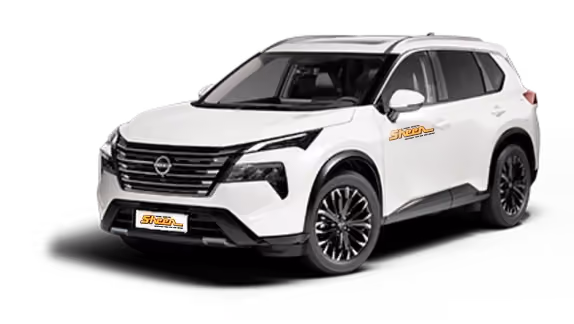 White Nissan X-Trail midsize SUV viewed from the front-left angle with black trim, roof rails, and alloy wheels.
