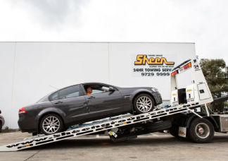 Sheen tow truck loading a car for emergency towing in Melbourne.