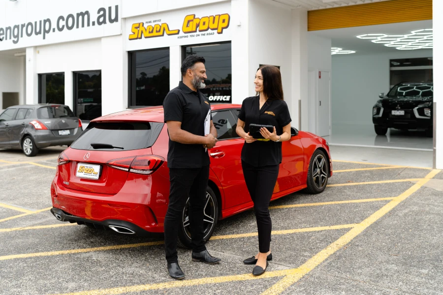 Our insurer-approved Melbourne panel beater at the computer, making a claim.