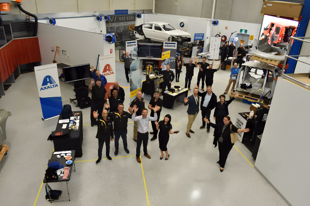 Jason Trewin with collision repair professionals at an automotive industry training and networking event.